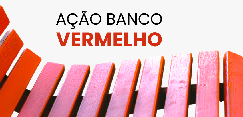 Foto de parte do assento de um banco de praça vermelho com o texto: ação banco vermelho